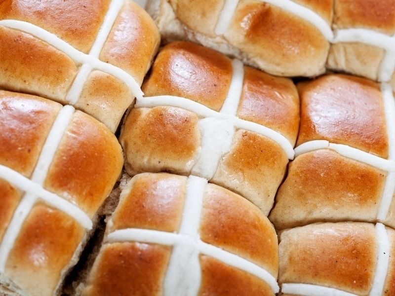 Image of hot cross buns that are harmful to dogs due to the dried fruit that can cause liver failure